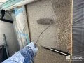 外壁塗装① 元の色味を活かしながら、意匠性を損なわないよう丁寧に塗装しました。[外壁石調部・中塗り]
