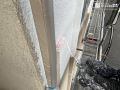 外壁塗装① 経年の汚れが目立っていた外壁を丁寧に塗り替えました。[外壁（吹き付け部）・下塗り]