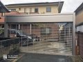 アルミのシンプルでシャープなデザインが建物と調和したシャッターゲート設置工事